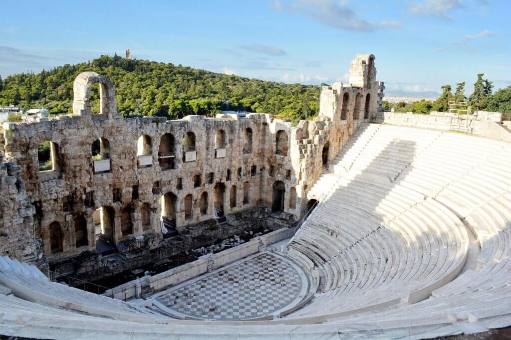 The Odeon of Herodes Atticus, a historic theater located on the slopes of the Acropolis in Athens, Greece, with its ancient stone structure and scenic surroundings.