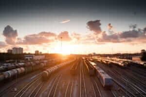 Affordable transportation: Train traveling through scenic countryside.